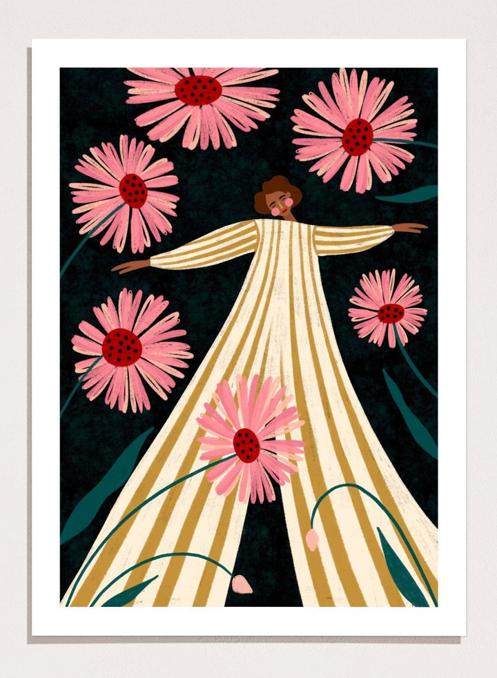 A framed art print featuring a stylized illustration of a woman in a cream and gold striped dress surrounded by large pink flowers on a dark background. Joyful Woman In Bloom by Bea Müller premium framed fine art print featuring a woman in a striped dress surrounded by oversized pink flowers.