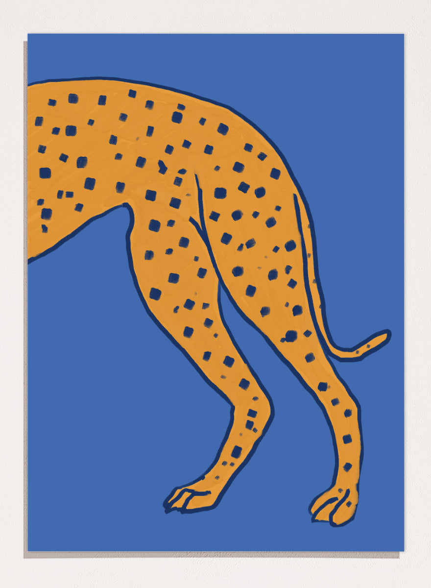 A stylized illustration of a spotted big cat, cropped to show the torso and hind legs, in orange with dark blue spots on a solid blue background. Spotted Cheetah on Blue by The Art Concept animal art print featuring a cropped golden cheetah with deep blue spots against a bold blue background.