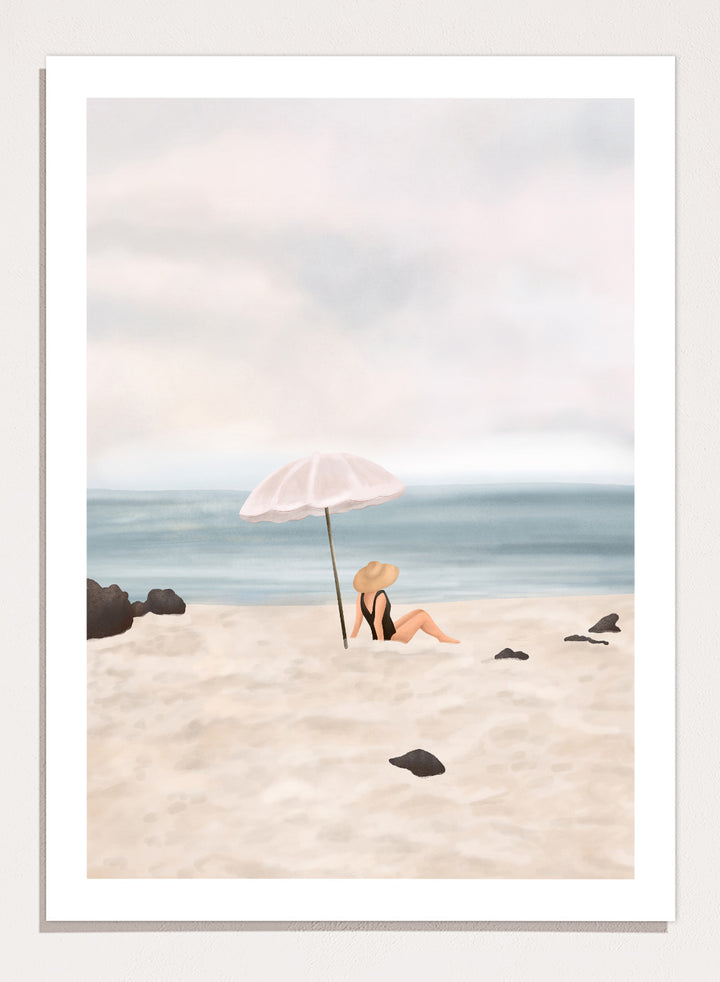 Woman under an umbrella on a beach with a calm ocean and sky. Serene Beach Scene by Flow Line is a coastal art print featuring a woman by the ocean, beach umbrella, seaside illustration, and summer wall art.