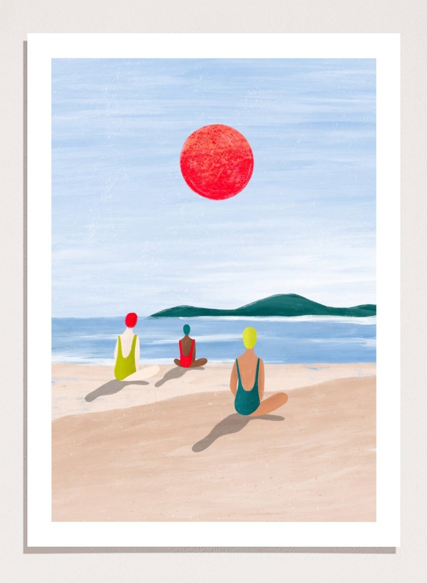 A minimalist art print depicting three figures meditating on a sandy beach under a large red sun. Red Sun Beach Serenity by Bea Müller premium fine art print featuring three figures on a beach beneath a bold red sun in a calm coastal setting.