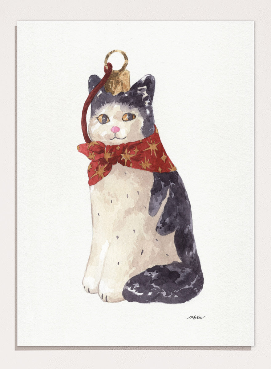Shop Christmas Cat Ornament by NKTN, a festive cat animal wall art print poster featuring a black-and-white cat in a red star scarf with watercolor detail.