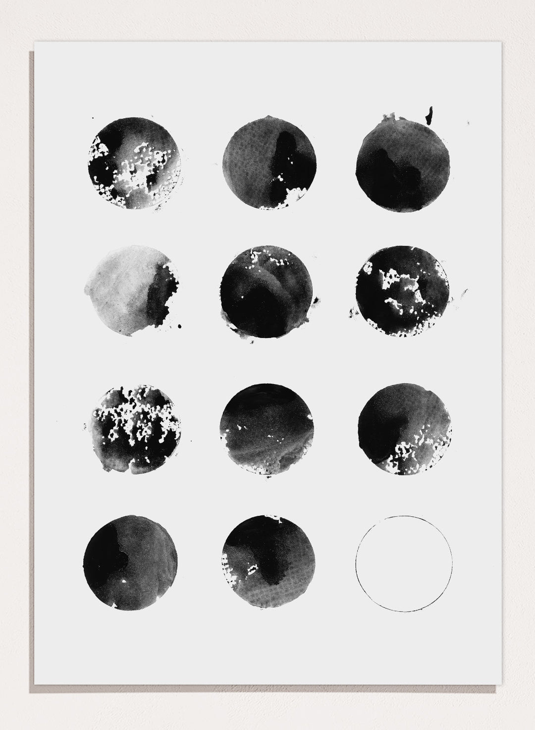 Black and white pattern of circular shapes on a textured background. Fluid Black Circles by Florent Bodart is a minimalist abstract art print with black ink circles, a modern black and white wall poster with graphic grid design.