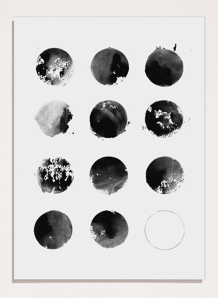 Black and white pattern of circular shapes on a textured background. Fluid Black Circles by Florent Bodart is a minimalist abstract art print with black ink circles, a modern black and white wall poster with graphic grid design.