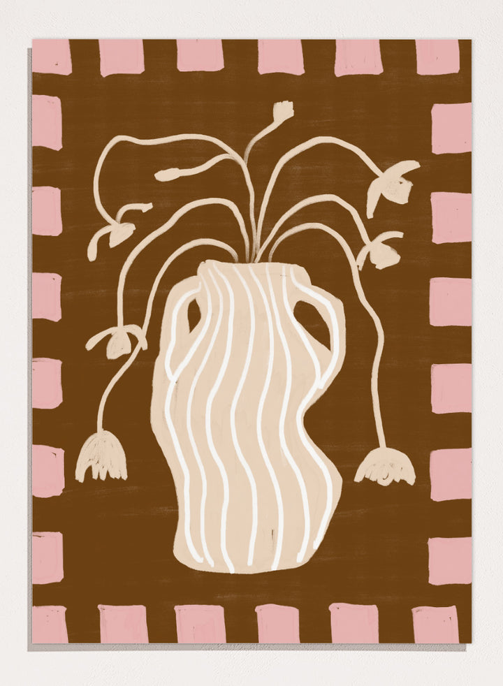 A stylized art print featuring a cream-colored wavy vase with stems and hanging flower buds on a brown background, framed by a pink and brown checkered border. Soft Floral Arrangement by The Art Concept still life art print featuring a striped vase, drooping flowers, warm brown tones, and a soft pink border.
