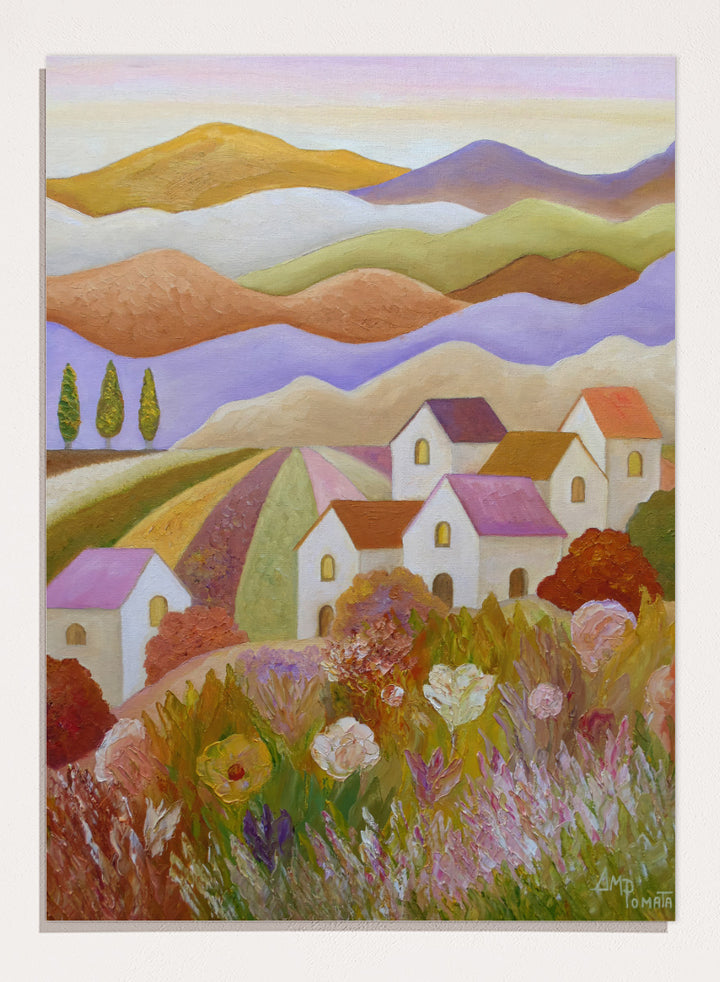 A colorful landscape painting featuring rolling hills, stylized houses, cypress trees, and wildflowers in the foreground, rendered in a painterly impressionistic style. Shop Colorful Countryside Village by Angeles M. Pomata, an autumn landscape art print featuring white houses, rolling hills, wildflowers, and warm earthy tones.