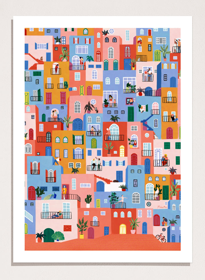 A framed art print featuring a colorful, whimsical illustration of Mediterranean-style buildings with people, animals, and plants. Colorful Town Life by Ceyda Alasar city art print featuring vibrant buildings, balconies, neighbors, plants, and lively urban details in bold color.
