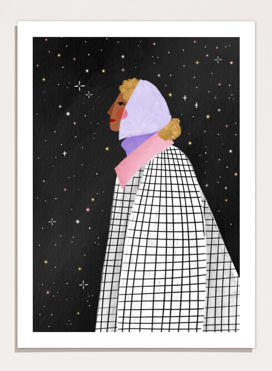 A framed art print featuring a stylized illustration of a woman in profile wearing a white and black checkered cape and a lavender headscarf against a black starry background. Shop Woman Under Starry Night by Bea Müller, a figurative wall art print poster featuring a contemplative woman beneath a star-filled black night sky.