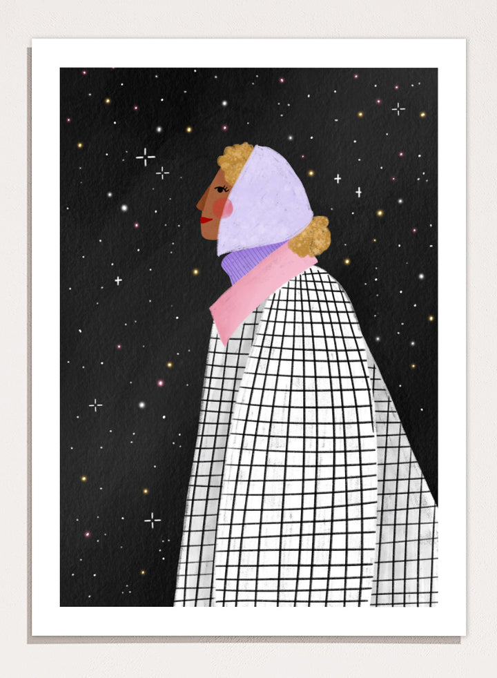 A framed art print featuring a stylized illustration of a woman in profile wearing a white and black checkered cape and a lavender headscarf against a black starry background. Shop Woman Under Starry Night by Bea Müller, a figurative wall art print poster featuring a contemplative woman beneath a star-filled black night sky.