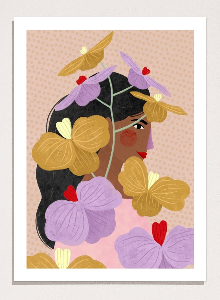 A framed art print featuring a stylized illustration of a woman with dark hair surrounded by large purple and yellow flowers on a beige patterned background. Floral Woman Portrait by Bea Müller premium framed fine art print featuring a woman surrounded by oversized lilac, mustard, and red flowers.