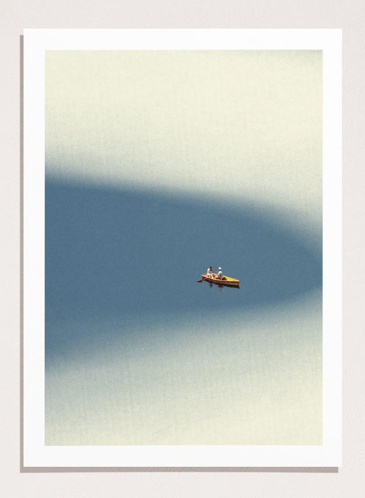 Happy Memories by Maarten Léon is an officially licensed art print featuring a minimalist boat scene with soft blue tones and open water. Available as a premium fine art print with optional real wood framing.