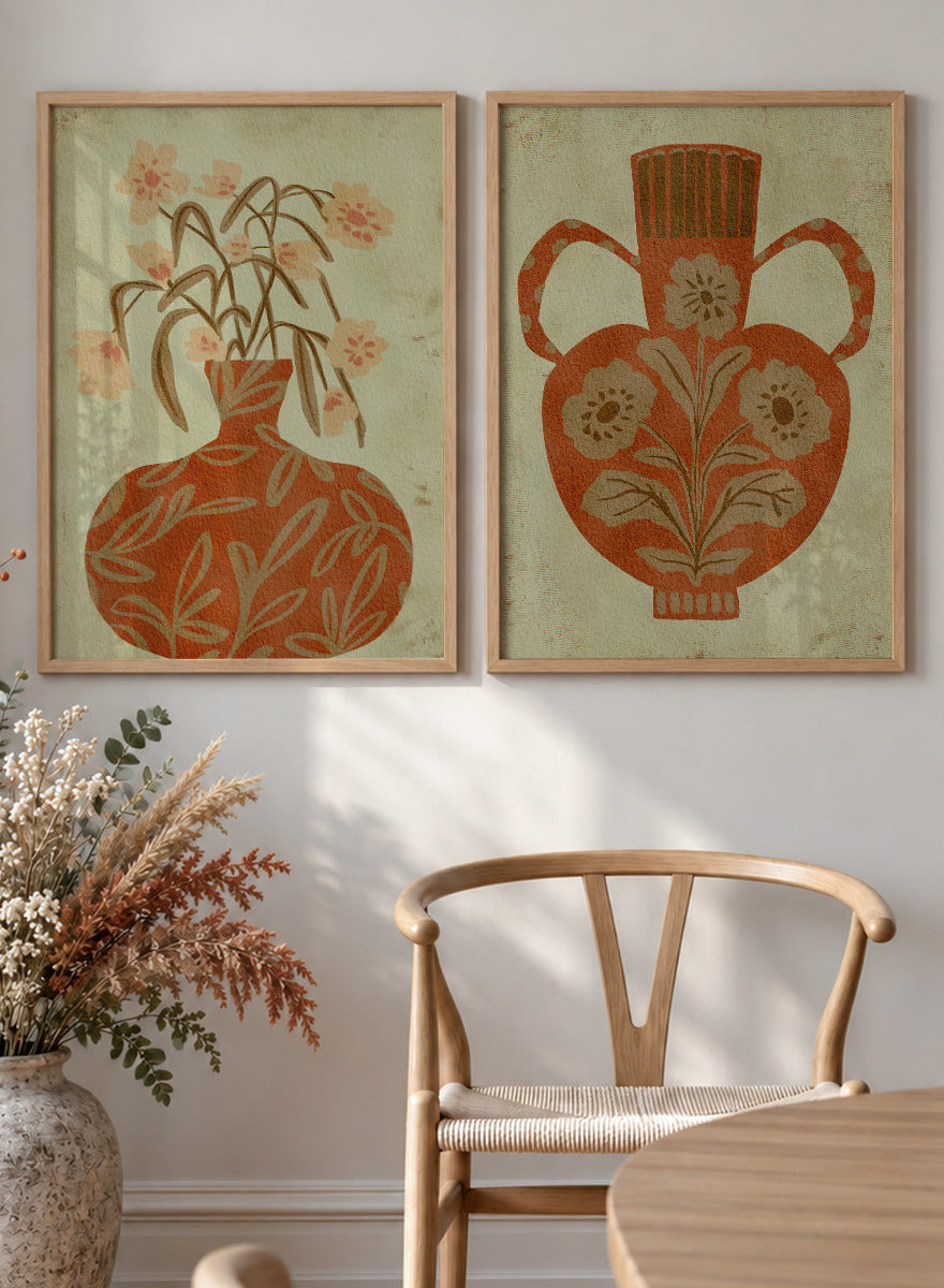 Shop Terracotta Floral Vases by Nikita Jariwala, a set of 2 botanical wall art prints posters featuring floral vase artwork in warm orange tones.