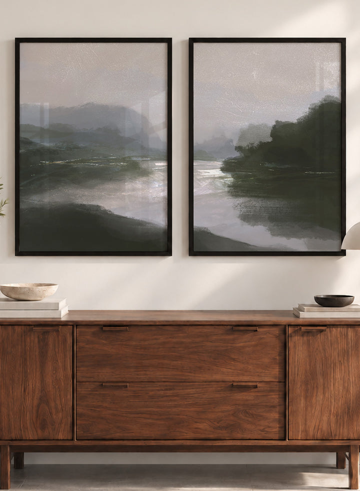 Shop Tranquillitas by Dan Hobday, a set of 2 landscape wall art prints posters featuring misty water, tree-lined banks, distant hills, and deep grey green tones.