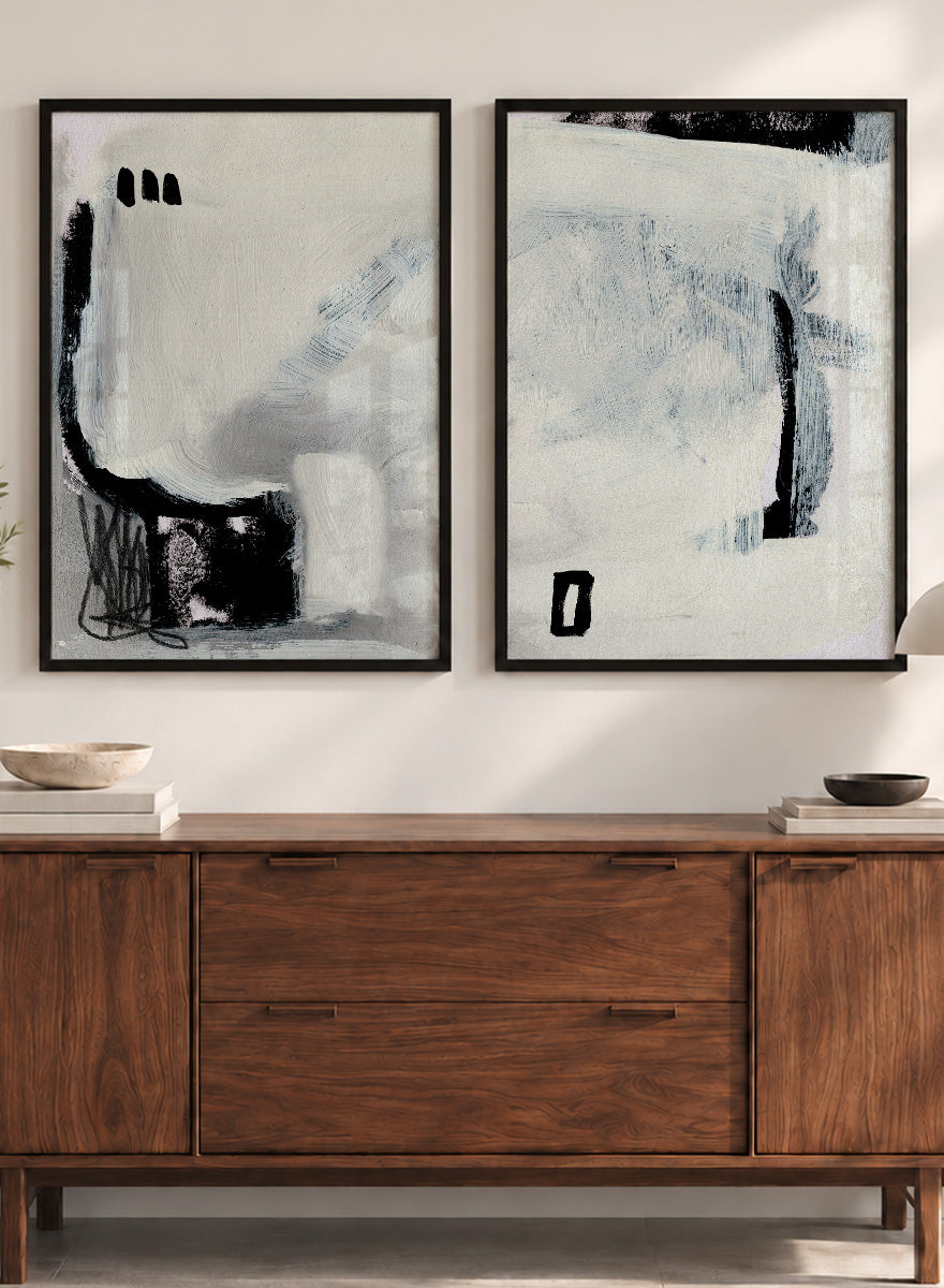 Shop Beyond by Dan Hobday, a set of 2 abstract wall art prints posters featuring expressive black forms, layered brushwork, and soft white and blue tones.