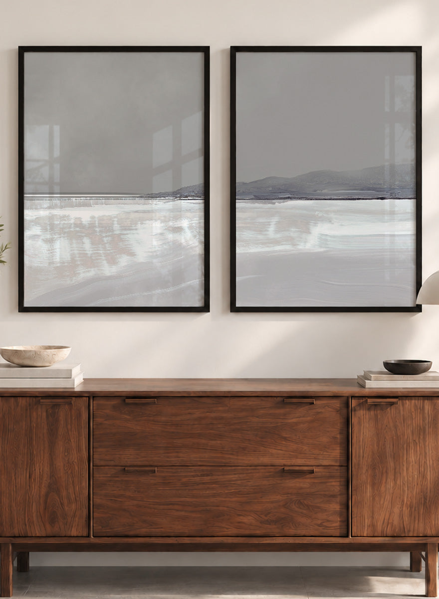 Shop Tides by Dan Hobday, a set of 2 coastal landscape wall art prints posters featuring calm water, distant hills, and soft gray-blue tones.