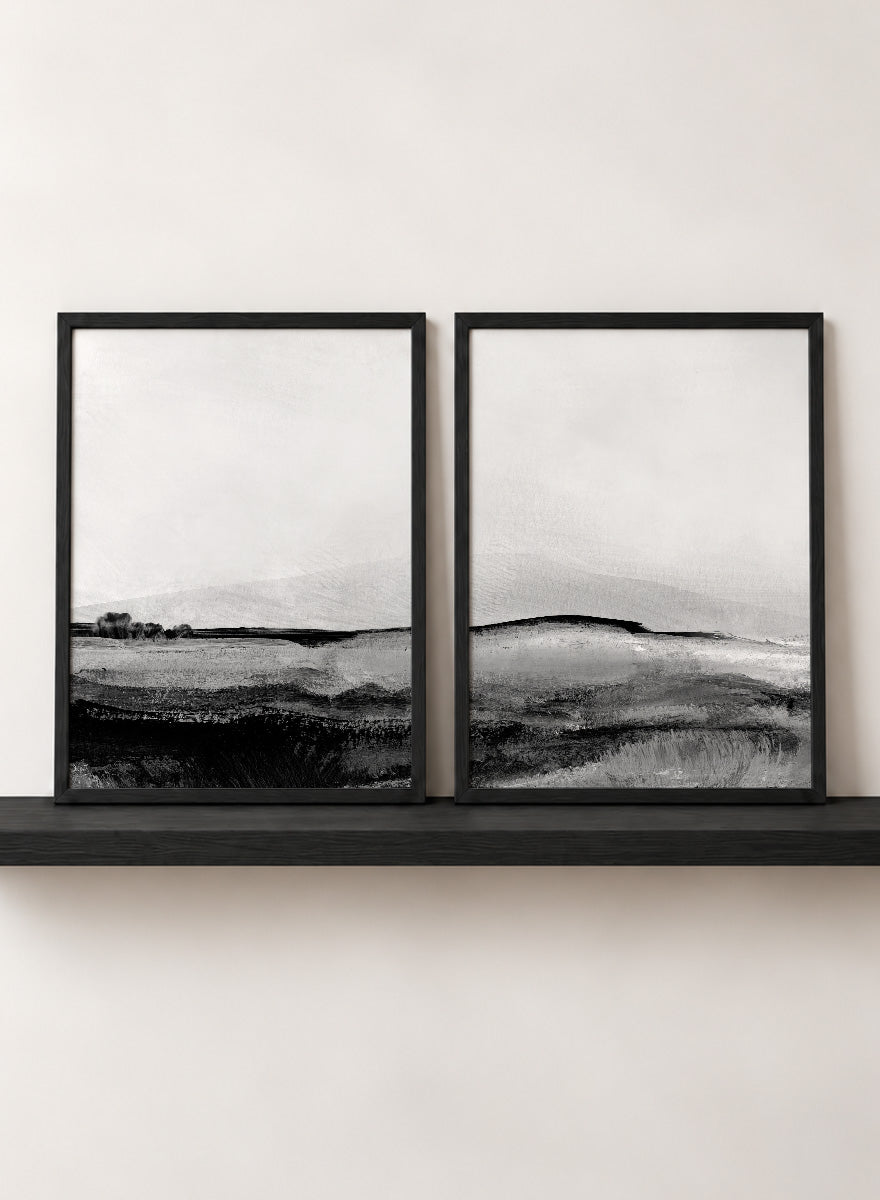 Shop Mono Landscape No.01 by Dan Hobday, a set of 2 black and white landscape wall art prints posters featuring layered hills and moody monochrome gray scenery.