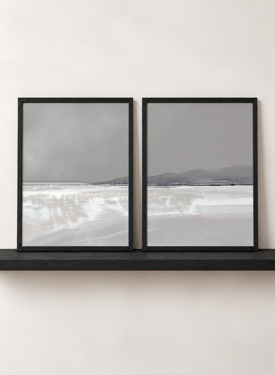 Shop Tides by Dan Hobday, a set of 2 coastal landscape wall art prints posters featuring calm water, distant hills, and soft gray-blue tones.
