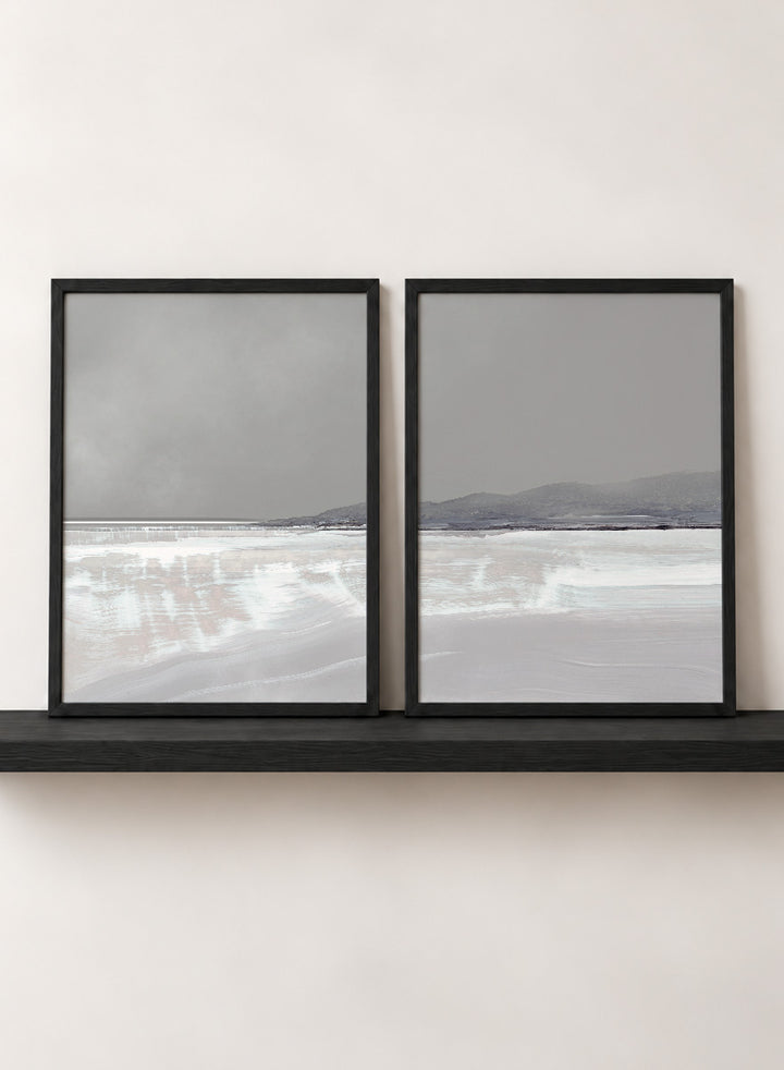 Shop Tides by Dan Hobday, a set of 2 coastal landscape wall art prints posters featuring calm water, distant hills, and soft gray-blue tones.