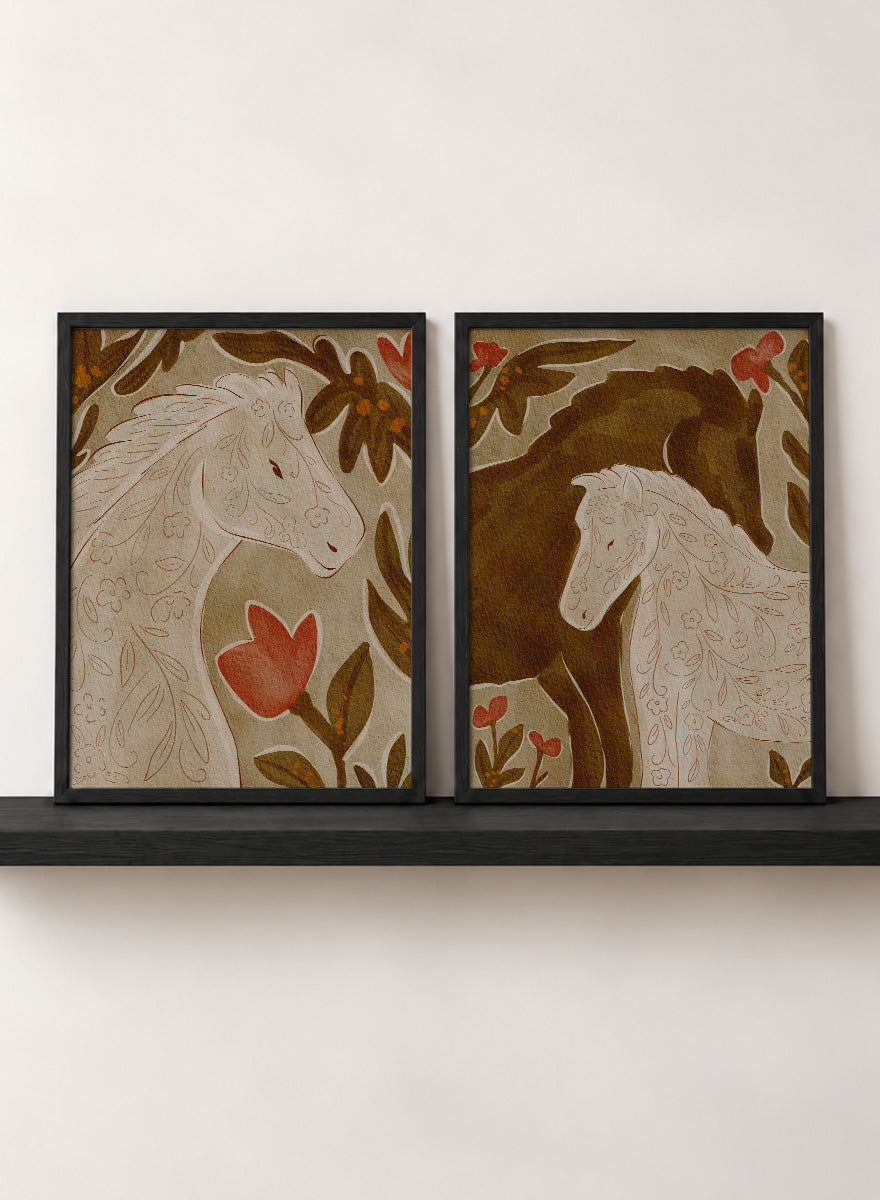 Two framed art prints depicting stylized horses in warm earthy tones. Shop Wildflower Horses by Nikita Jariwala, a set of 2 horse wall art prints posters featuring floral horse portraits, botanical details, and warm brown tones.