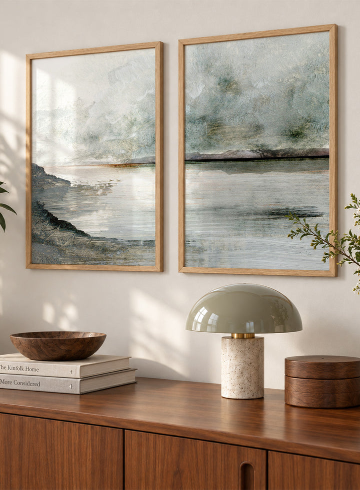 Shop Still Coast by Dan Hobday, a set of 2 coastal landscape wall art prints posters featuring misty water, rocky shoreline, and soft gray and green tones.