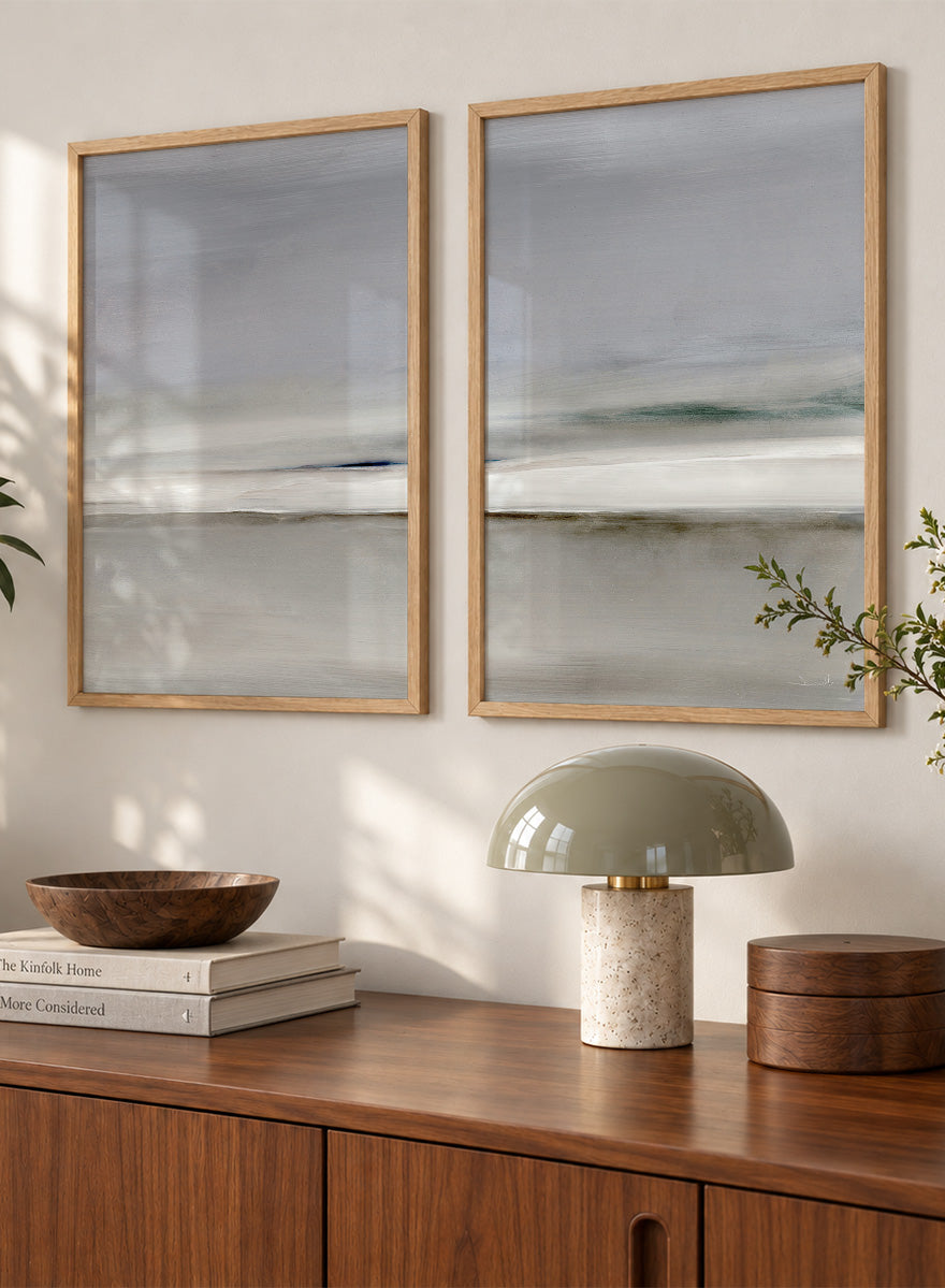 Shop Horizon by Dan Hobday, a set of 2 minimalist landscape wall art prints posters featuring soft gray seascapes, open water, and a quiet horizon.