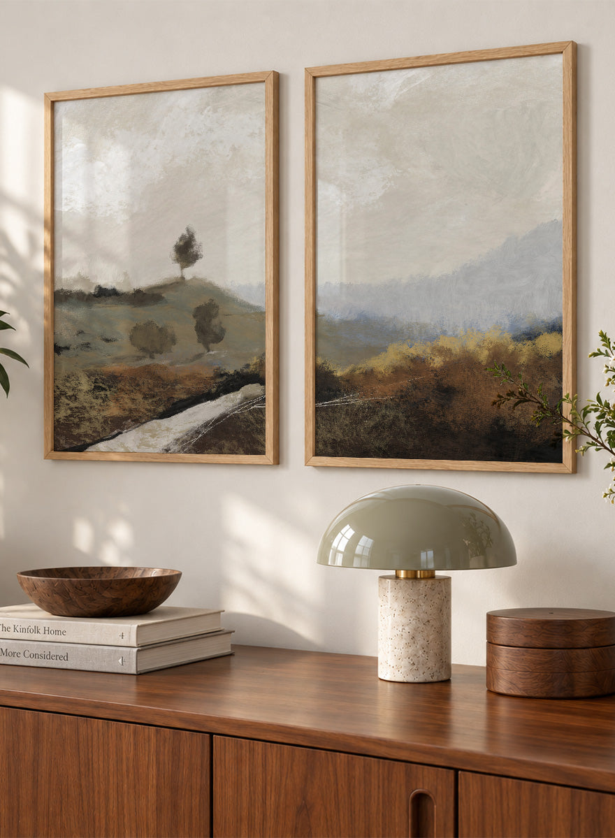 Shop La Collina by Dan Hobday, a set of 2 landscape wall art prints posters featuring rolling hills, winding paths, and warm earthy countryside tones.