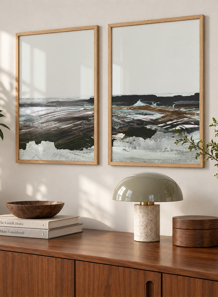 Shop Constantine Bay by Dan Hobday, a set of 2 coastal landscape wall art prints posters featuring windswept shoreline, surf, and muted blue-brown tones.