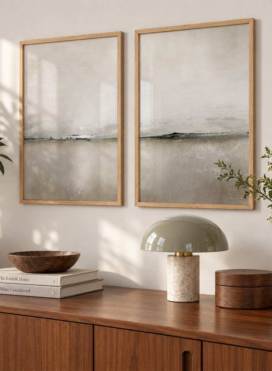 Shop Sunlight Bay by Dan Hobday, a set of 2 minimalist landscape wall art prints posters featuring a soft horizon, open water, and warm brown and cream tones.