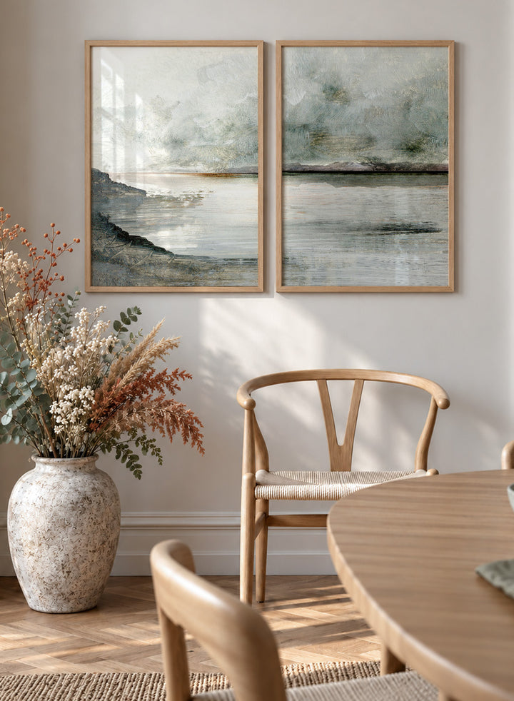 Shop Still Coast by Dan Hobday, a set of 2 coastal landscape wall art prints posters featuring misty water, rocky shoreline, and soft gray and green tones.