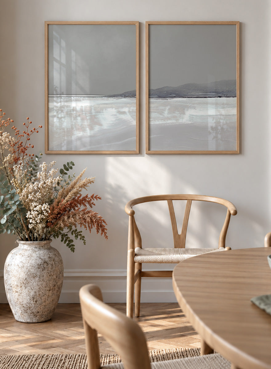 Shop Tides by Dan Hobday, a set of 2 coastal landscape wall art prints posters featuring calm water, distant hills, and soft gray-blue tones.
