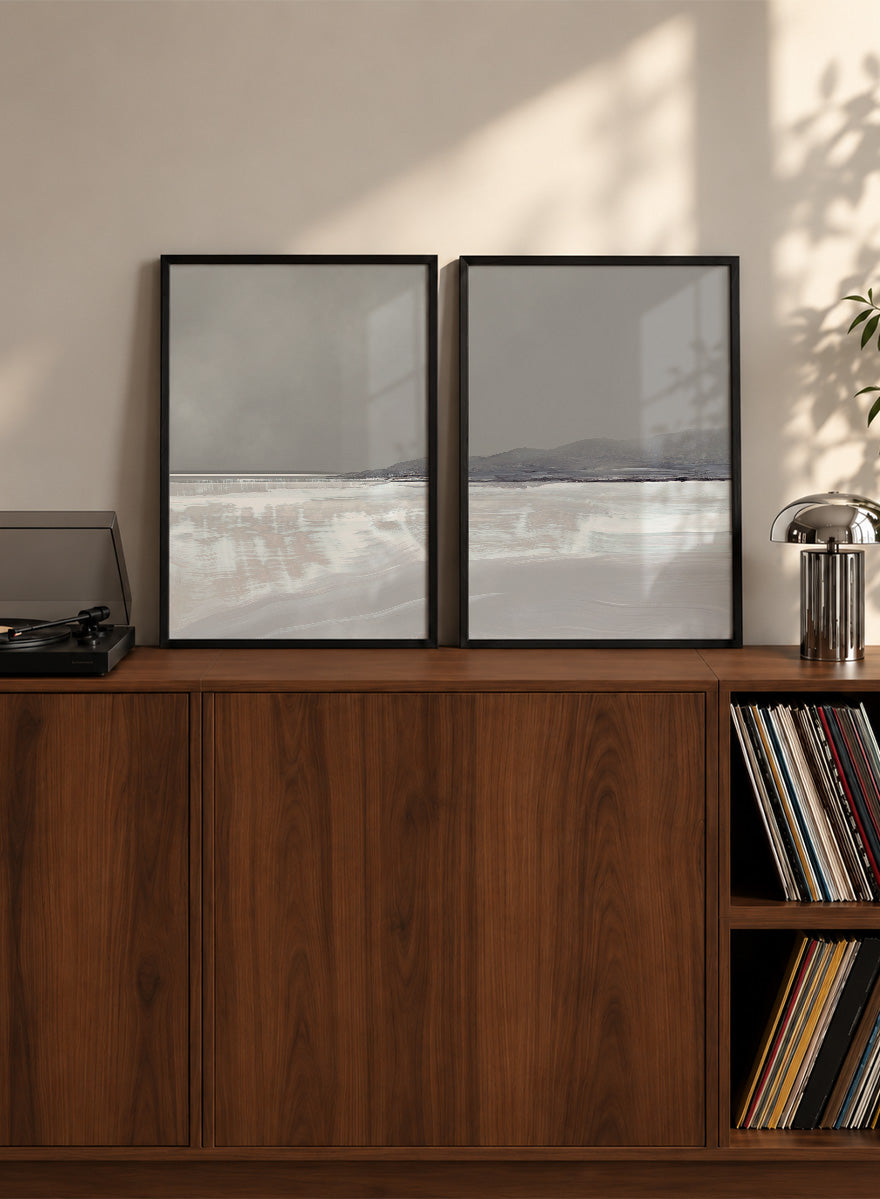 Shop Tides by Dan Hobday, a set of 2 coastal landscape wall art prints posters featuring calm water, distant hills, and soft gray-blue tones.