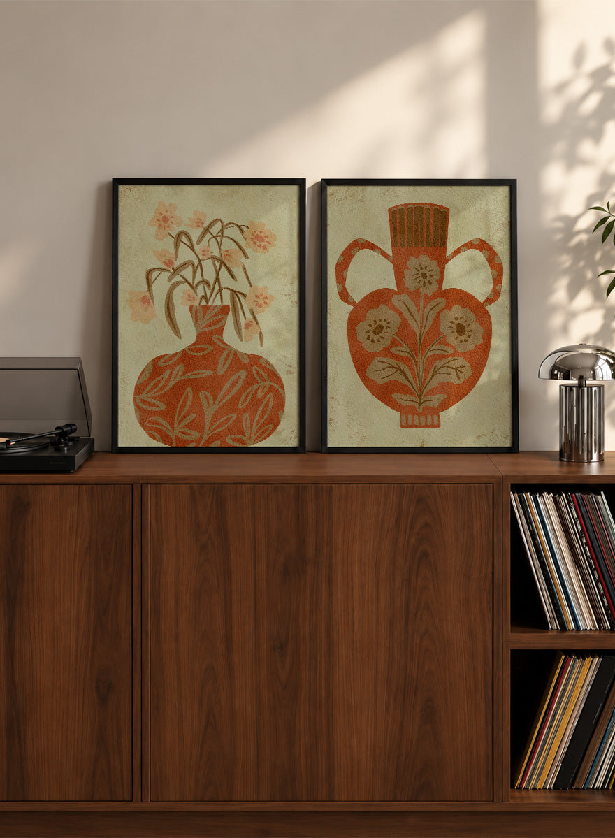Shop Terracotta Floral Vases by Nikita Jariwala, a set of 2 botanical wall art prints posters featuring floral vase artwork in warm orange tones.