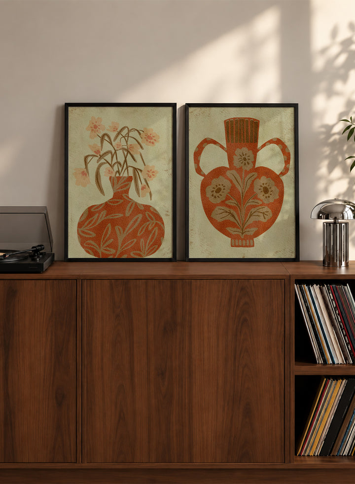 Shop Terracotta Floral Vases by Nikita Jariwala, a set of 2 botanical wall art prints posters featuring floral vase artwork in warm orange tones.