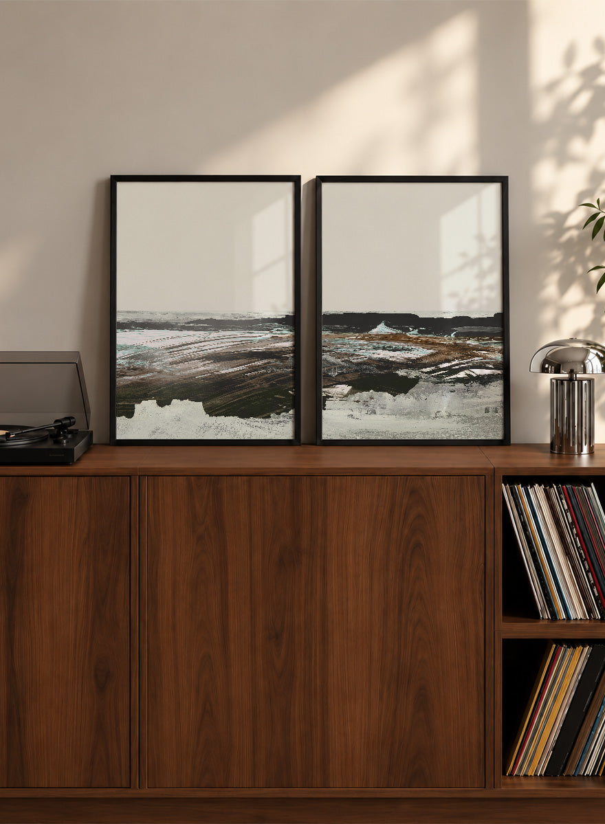 Shop Constantine Bay by Dan Hobday, a set of 2 coastal landscape wall art prints posters featuring windswept shoreline, surf, and muted blue-brown tones.