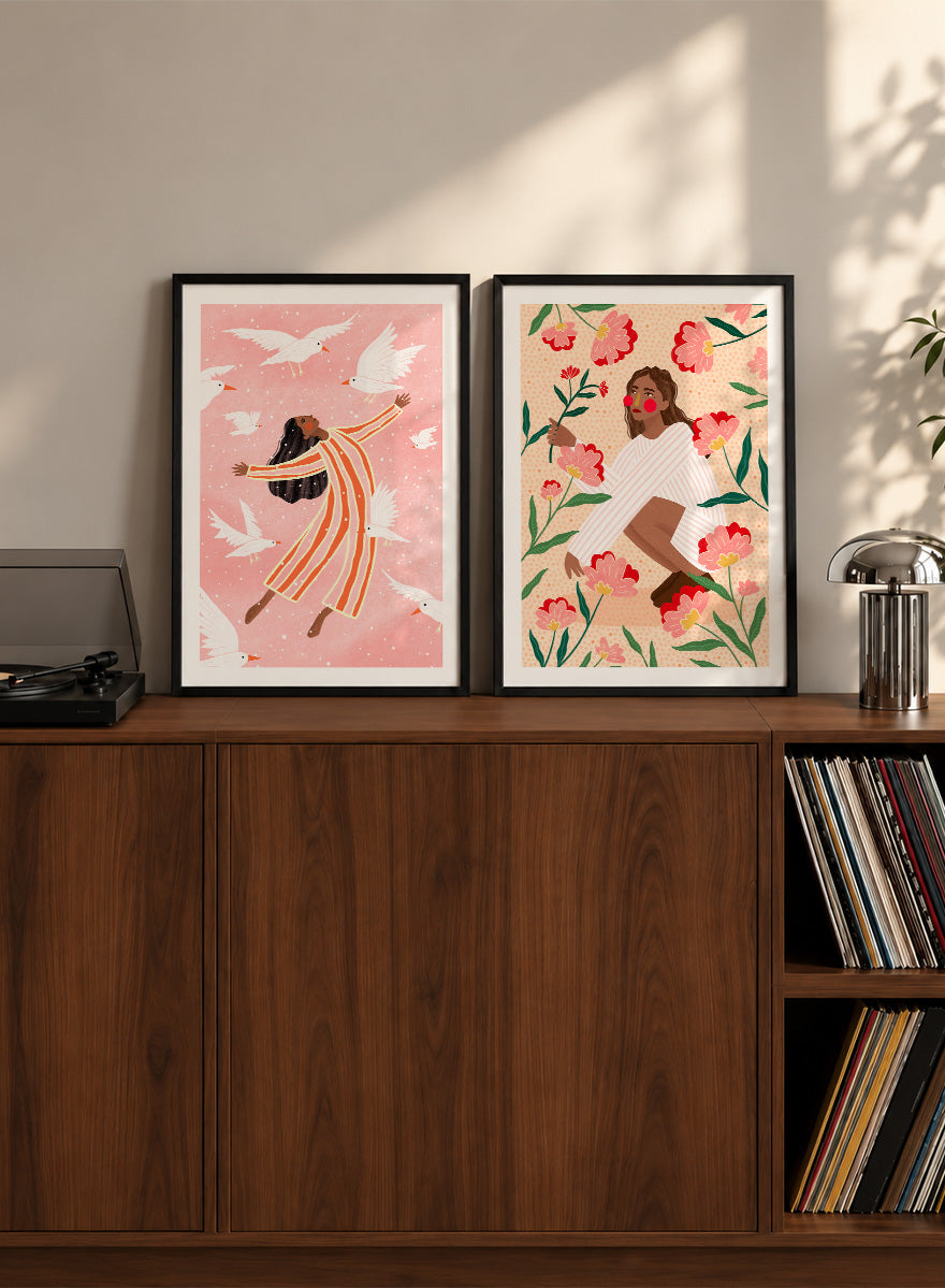 Shop In Her Happy Place by Bea Müller, a set of 2 figurative wall art prints posters featuring women surrounded by birds and flowers in soft pink tones.
