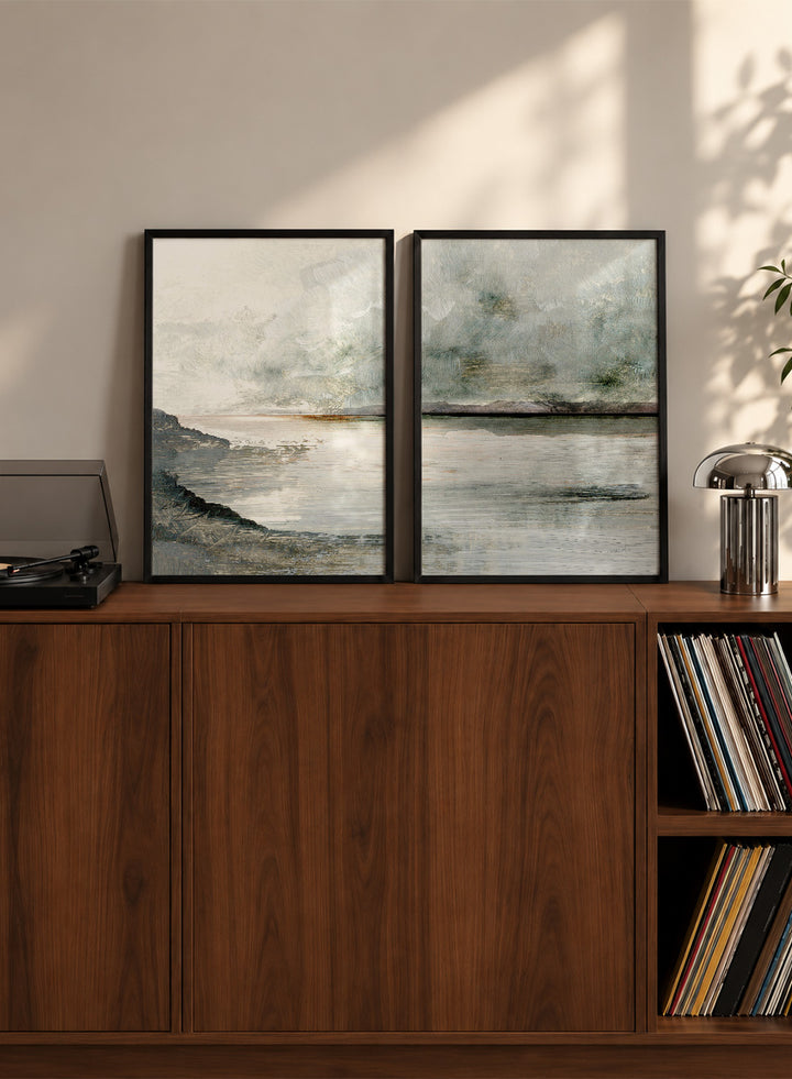 Shop Still Coast by Dan Hobday, a set of 2 coastal landscape wall art prints posters featuring misty water, rocky shoreline, and soft gray and green tones.