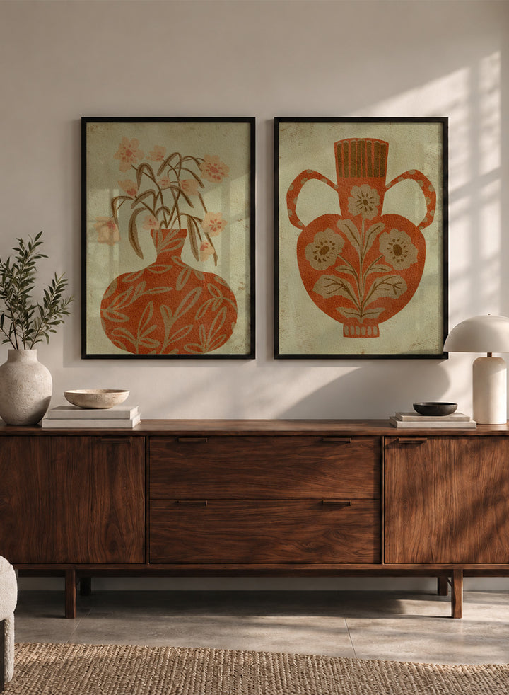 Shop Terracotta Floral Vases by Nikita Jariwala, a set of 2 botanical wall art prints posters featuring floral vase artwork in warm orange tones.