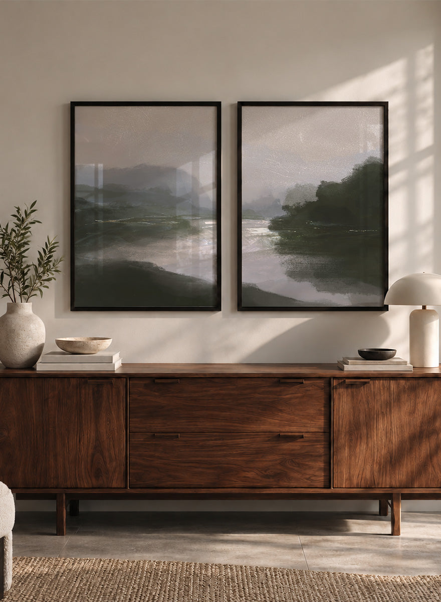 Shop Tranquillitas by Dan Hobday, a set of 2 landscape wall art prints posters featuring misty water, tree-lined banks, distant hills, and deep grey green tones.