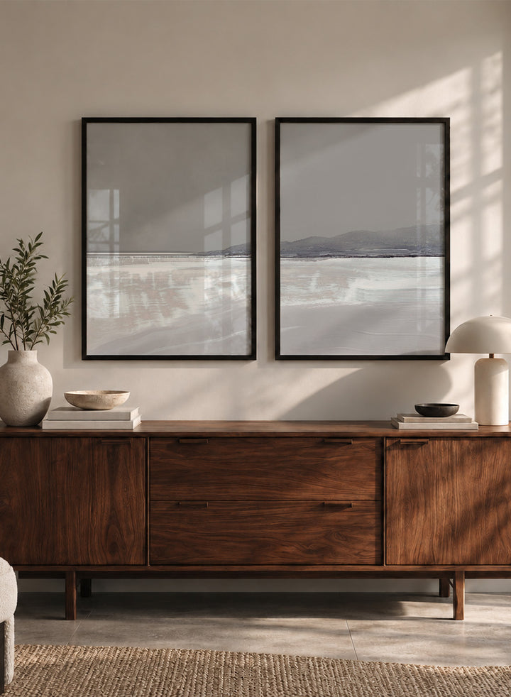 Shop Tides by Dan Hobday, a set of 2 coastal landscape wall art prints posters featuring calm water, distant hills, and soft gray-blue tones.