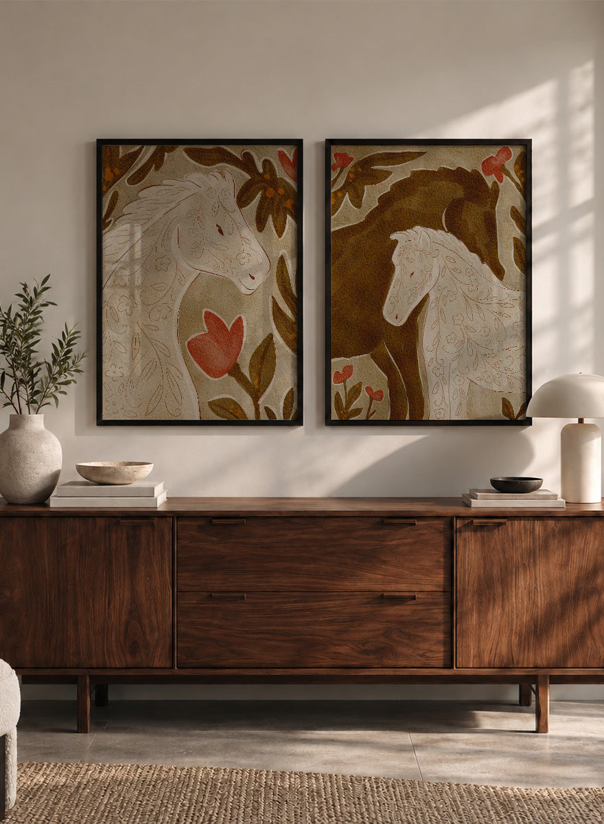 Two framed art prints depicting stylized horses in warm earthy tones. Shop Wildflower Horses by Nikita Jariwala, a set of 2 horse wall art prints posters featuring floral horse portraits, botanical details, and warm brown tones.
