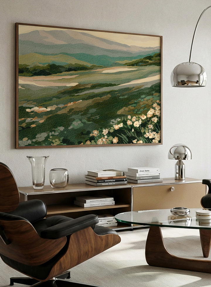 Shop Wildflower Mountain Landscape by Nikita Jariwala, a mountain wall art print with rolling green hills, cream wildflowers, and soft sage and blue-gray tones.