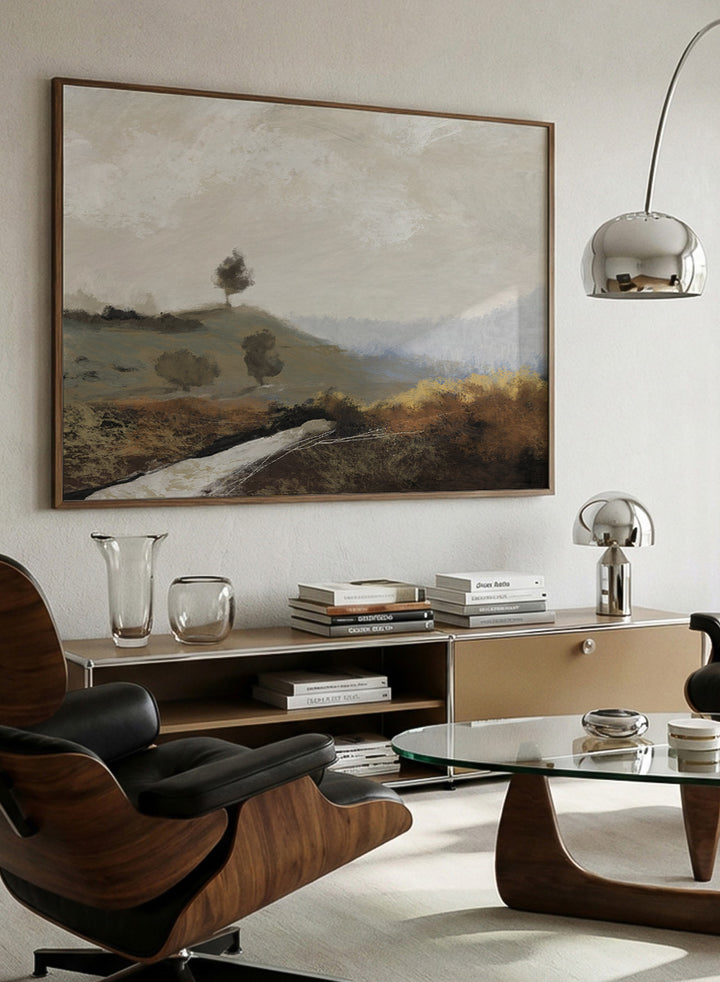 Shop La Collina by Dan Hobday, a contemporary landscape art print featuring rolling hills, scattered trees, earthy brown tones, and soft blue-gray distance.