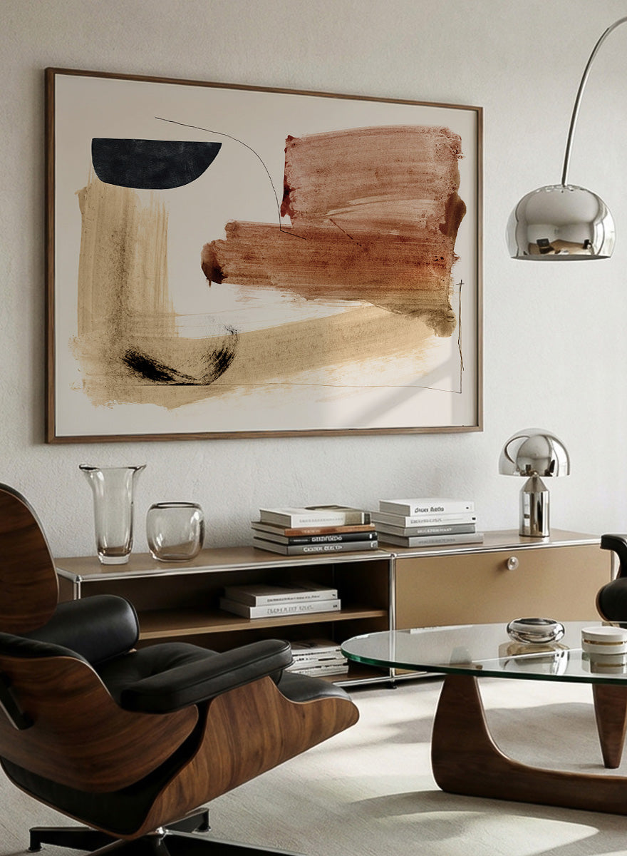 Abstract framed wall art featuring broad brushstrokes in terracotta, beige, black, and brown on a cream background. Shop Cooking by Dan Hobday, a warm abstract art print featuring rust brown, black, and sandy neutral forms with loose lines and layered brush texture.