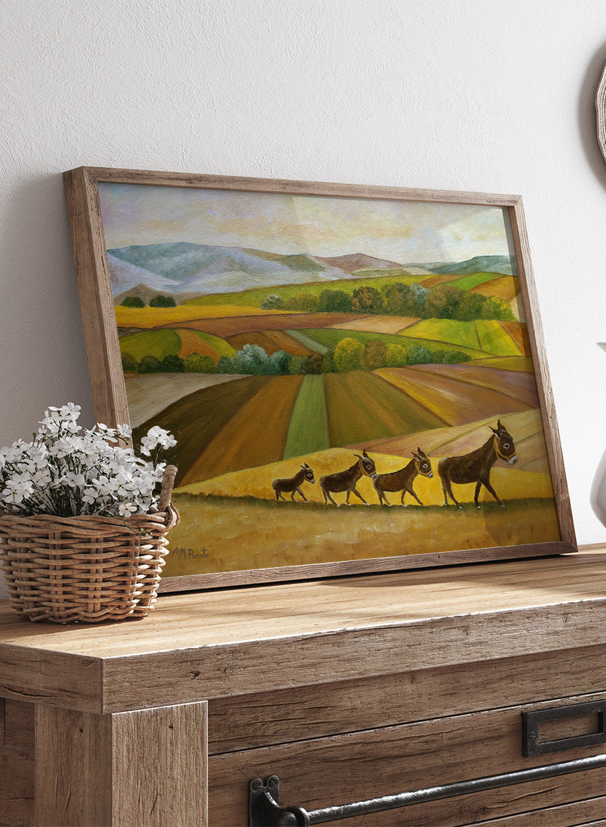 Shop Donkey Family Journey by Angeles M. Pomata, an autumn animal and countryside art print featuring a family of donkeys, patchwork fields, and rolling hills.