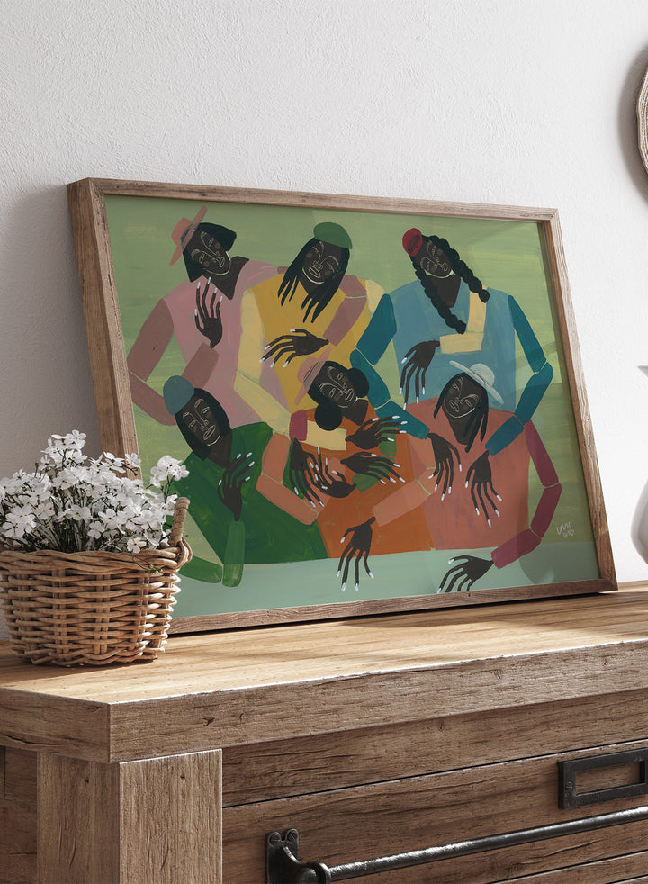 Framed artwork of six people sitting together with colorful clothing on a green background. Gossip by Studio IMO (Ibi Meier-Oruitemeka) is a modern figurative art print with multiple figures, bold color, and contemporary wall poster design.