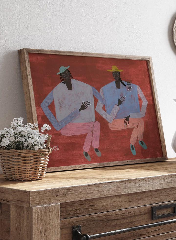 Artistic depiction of two figures holding hands on a red background. Better With You by Studio IMO (Ibi Meier-Oruitemeka) is a modern figurative art print with two figures, bold color, and contemporary wall poster design.