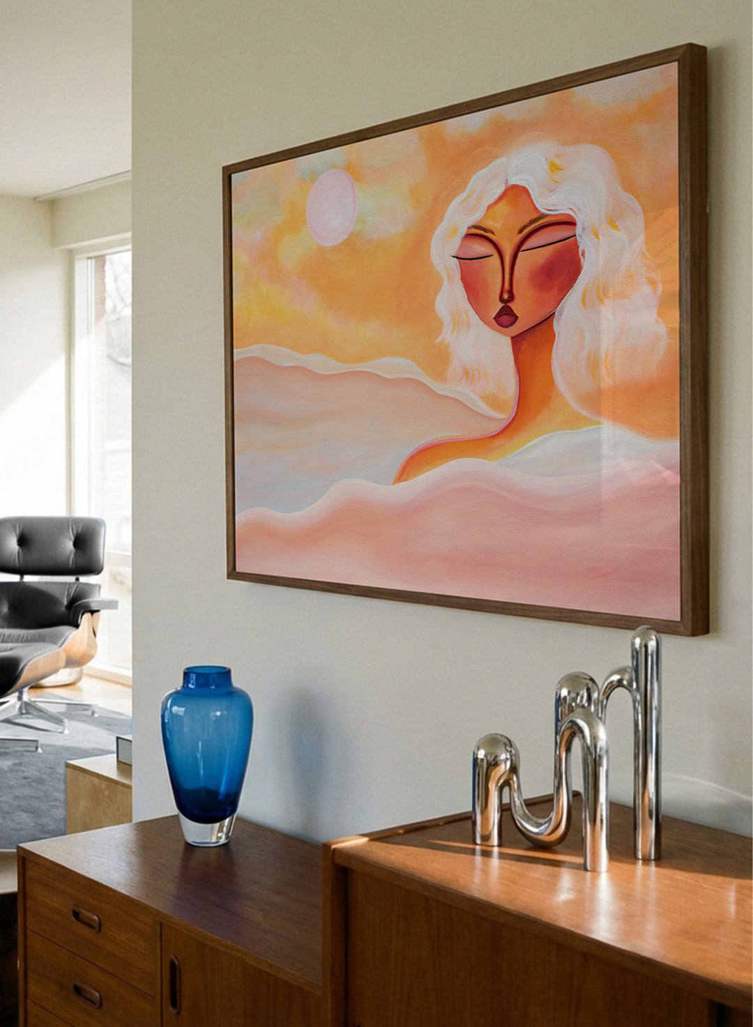 Framed abstract artwork with a woman's face and warm colors. Golden Hour Dreamer by Amy Straley is a contemporary figurative art print featuring warm sunset tones, a feminine portrait, and expressive modern artwork.