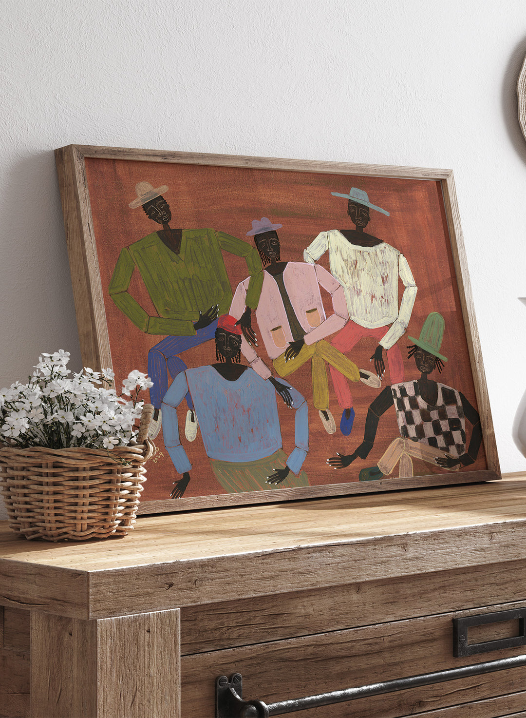 Framed artwork of six stylized figures in colorful clothing on a red background. Long Time No See by Studio IMO (Ibi Meier-Oruitemeka) is a modern figurative art print with multiple figures and bold contemporary wall poster design.