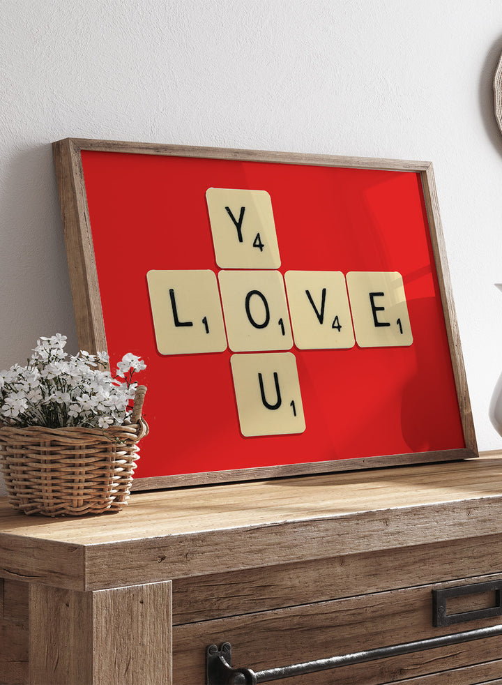 Scrabble tiles spelling LOVE YOU on a red background. Love You by Florent Bodart is a playful crossword-style art print featuring letter tiles spelling LOVE YOU on a red background. Retro typography wall poster with optional framing.