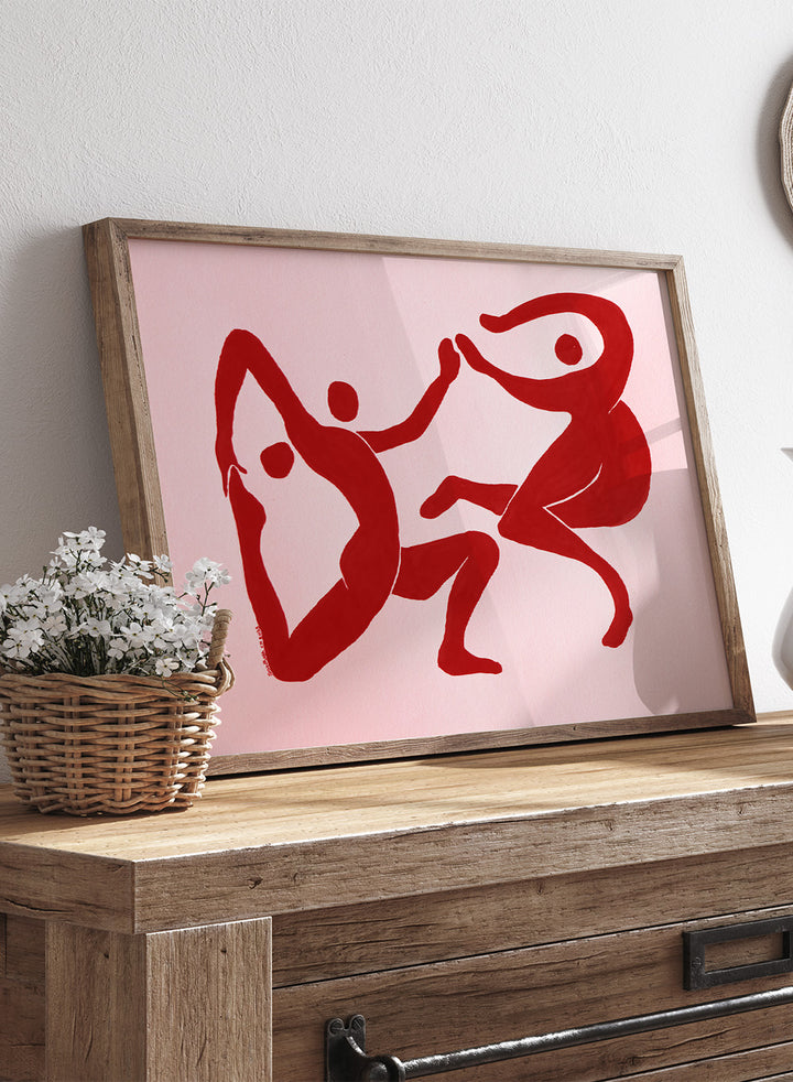 Red abstract figures on a pink background. Fluid Dance Forms by Santhosh CH is an abstract illustration art print featuring expressive human figures, bold red color, modern movement design, and contemporary wall art style.