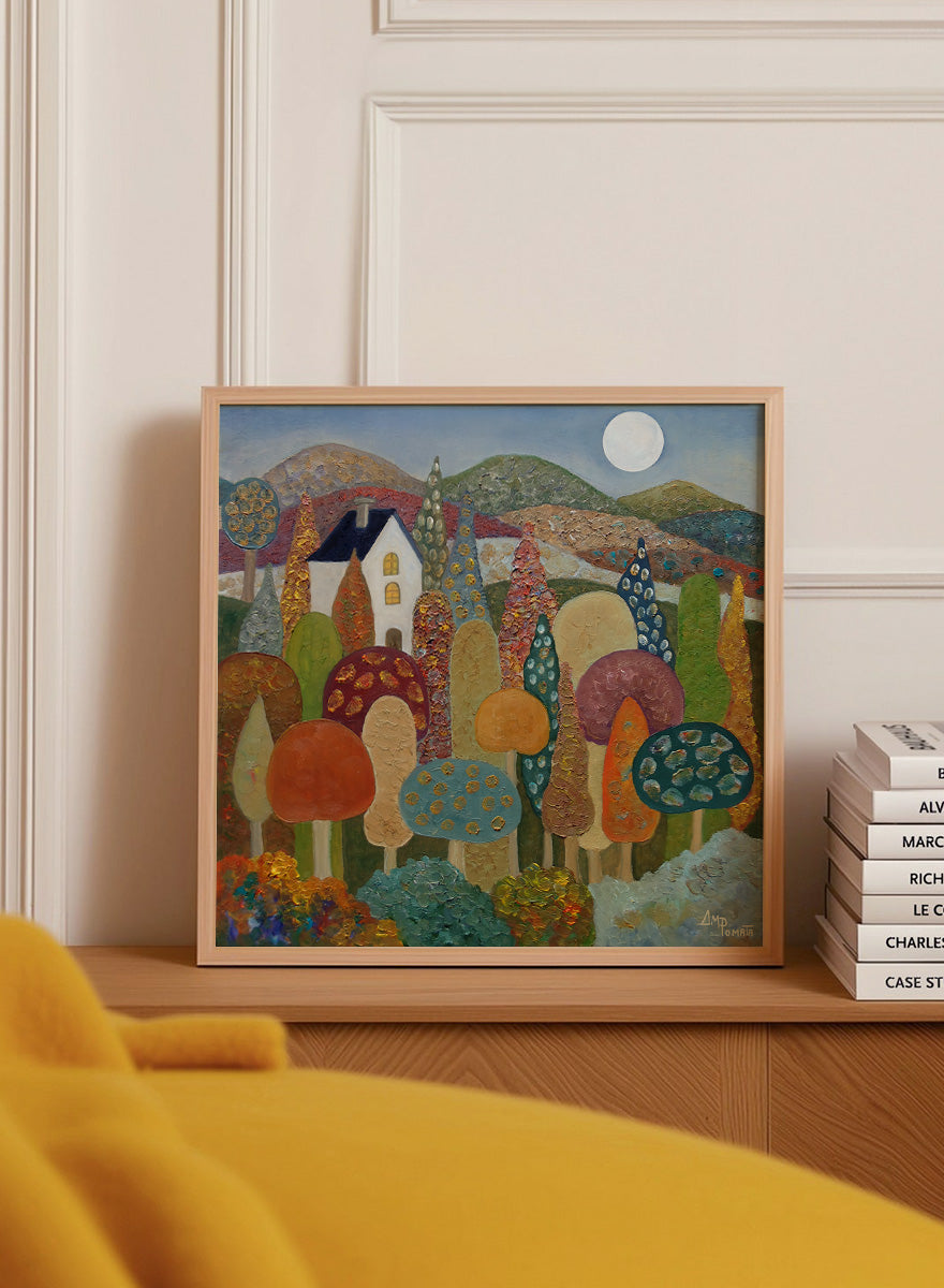 A framed folk-art style landscape painting featuring stylized mushrooms, trees, hills, a small house, and a full moon. Shop Whimsical Moonlit Landscape by Angeles M. Pomata, a colorful autumn landscape art print featuring a white house, full moon, rolling hills, and stylized trees.
